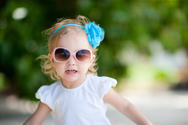 Portrait of adorable toddler girl fancy dressed