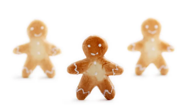 Três Biscoitos Bonitos Homens Gengibre Com Sombras Suaves Isoladas Fundo — Fotografia de Stock