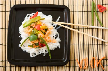 Delicious freshly cooked shrimps wok served clipart