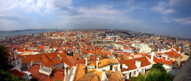 Bird view of central Lisbon with colorful houses and orange roofs