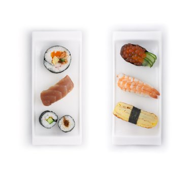 Different types of sushes (Futomaki, Sakemaki, Kappamaki, Ikura, Tamago, Ebi and Toro) placed on japanese style plates isolated on white background. clipart