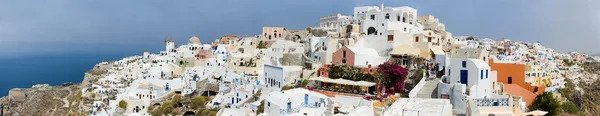 stock image More than 180 degrees panorama of Oia village at beautiful island of Santorini, Greece