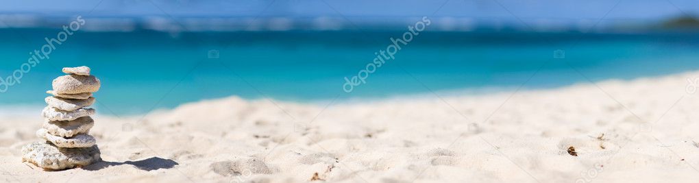 Panoramic photo of stack of white corals on tropical beach