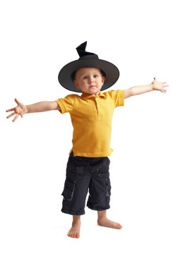 Halooween csarecrow. Very cute 3 years old boy in witch hat isolated on white background clipart