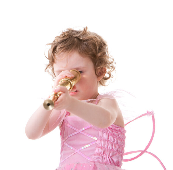 Cute curly haired girl in little fairy dress looking to telescope