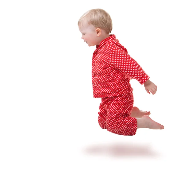 Kırmızı Pijama Atlama Içinde Yaşında Yürümeye Başlayan Çocuk Kız — Stok fotoğraf