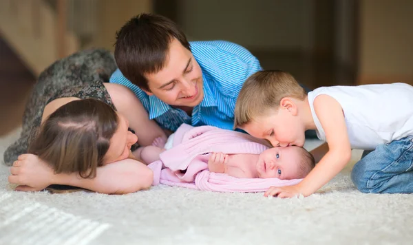 Happy Young Family Four Enjoying Time Home — Stock Photo, Image