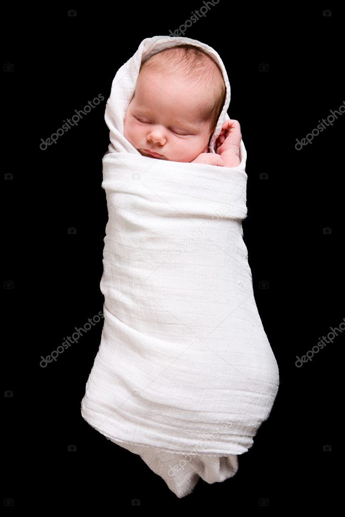 Baby Cocoon. Swaddled 15 days old newborn baby girl over black background