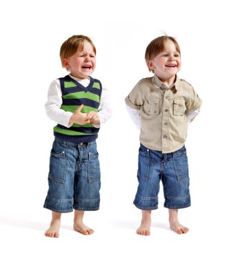 Twin series: One face two emotions. Two very cute twin boys (one smiling, another one crying) isolated on white background. clipart