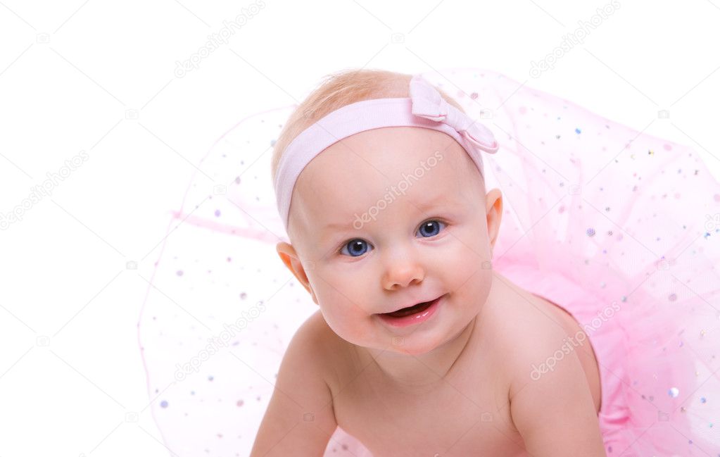 Baby Ballerina. Very cute happy baby girl wearing ballerina skirt. Isolated on white.