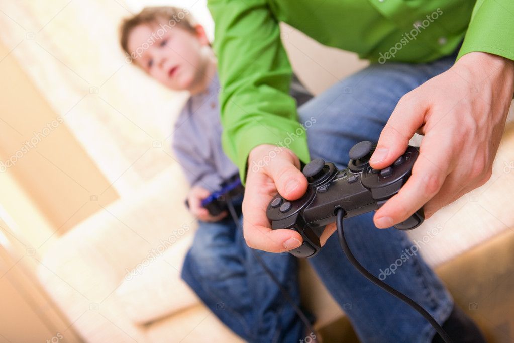 Father and son with video game controllers