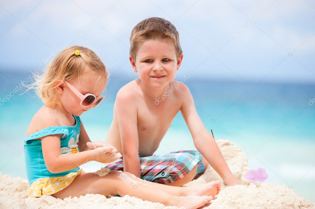 Two kids playing together at beach