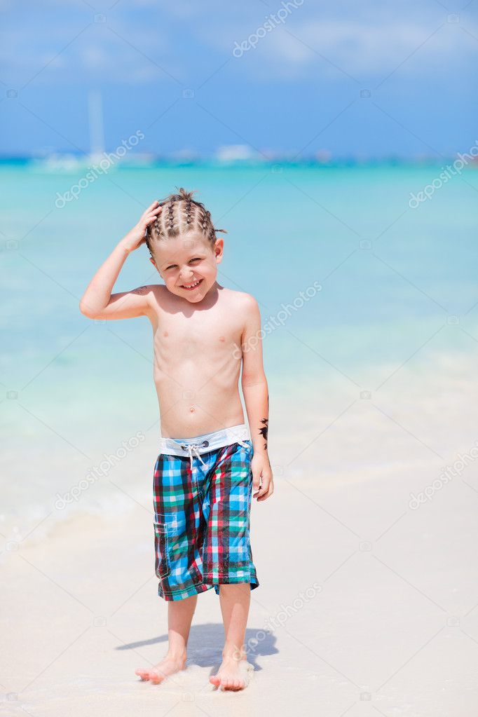 Cute Little Boy Funny Hair Style Standing Tropical Beach Stock Photo by  ©shalamov 4918888