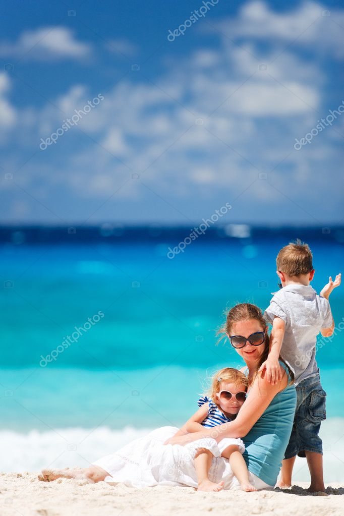 Mother with son and daughter on beach vacation