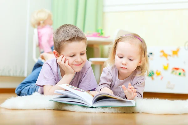 Brother and sister reading Stock Image