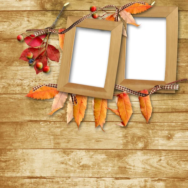 Wooden frame with autumn leaves