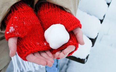 Snowball in hands clipart