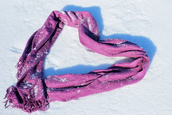 Scarf in the form of heart in the snow — Stock Photo, Image