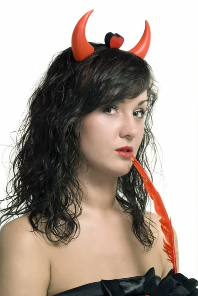 Piękna dziewczyna czerwony diabeł z piórem — Zdjęcie stockowe