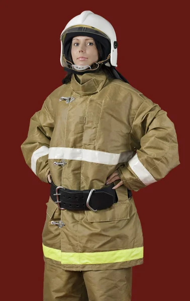 Meisje in brandweerman uniform — Stockfoto