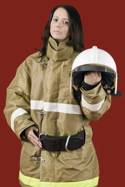 Menina em uniforme de bombeiro lá em cima — Fotografia de Stock
