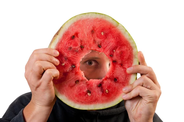 Eye looking through watermelon slice — Stock Photo, Image