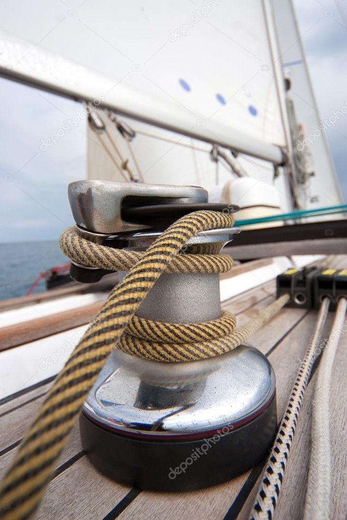 Winch with rope on sailing boat