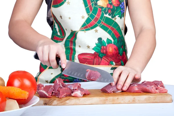 Woman cutting beef — Stock Photo, Image