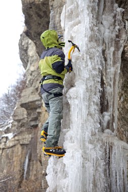 Man with ice axes and crampons clipart