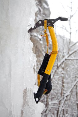 Climbing ice ax in the white ice clipart