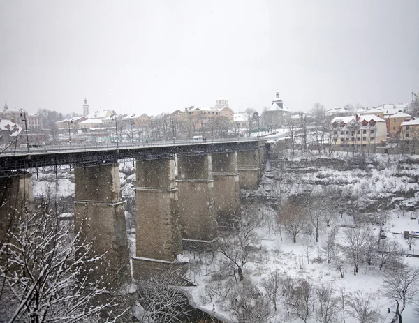 Bridge across the river under snow — Stock Photo, Image