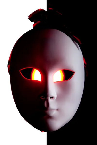 stock image Scary black and white mask with red eyes