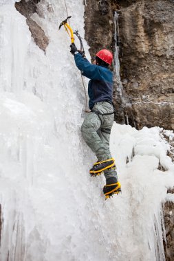 Man with ice axes and crampons clipart