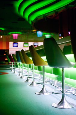 Chairs in row in bar clipart