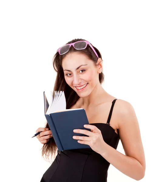 Krásná mladá dívka v černý korzet s kniha, pero a brýle izolovaných na wh — Stock fotografie