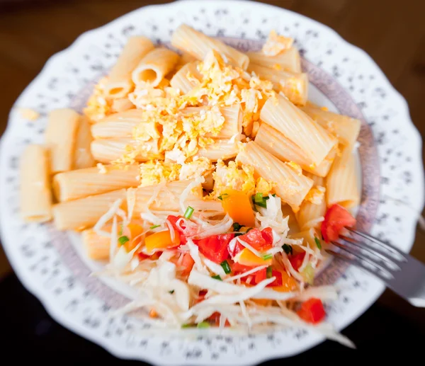 stock image Pasta with salad from tomato and cabbage