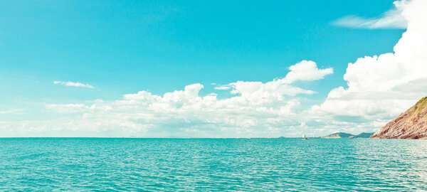 Tropical sea and cloudy sky