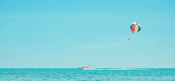 stock image Parachute and boat in sea