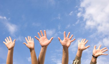 Hands rised up in air across sky clipart