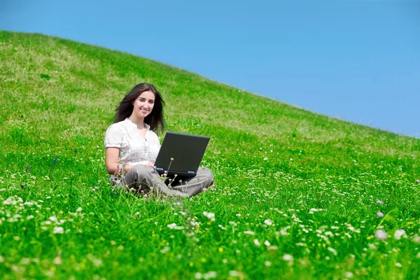Beautiful woman with notebook on hill — Stock Photo, Image