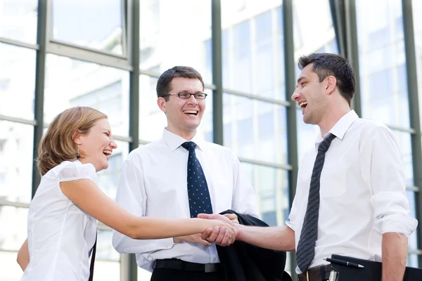 Handshake between office workers — Stock Photo, Image