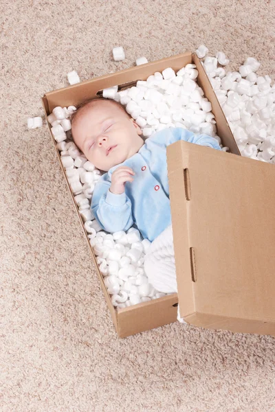 Newborn baby in open post box — Stock Photo, Image