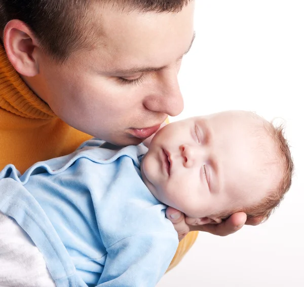 Father kisses his newborn baby — Stock Photo, Image