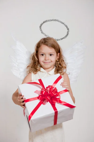 Girl with angel wings and set of gifts — Stock Photo, Image