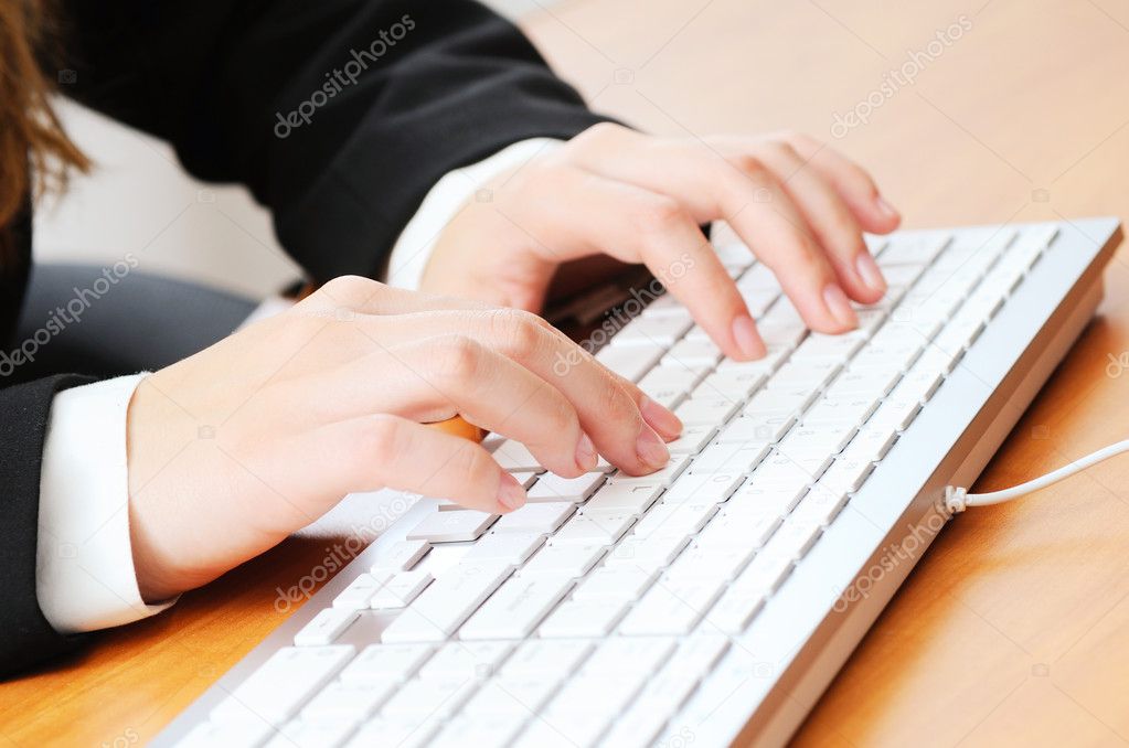 Woman typing something on keyboard