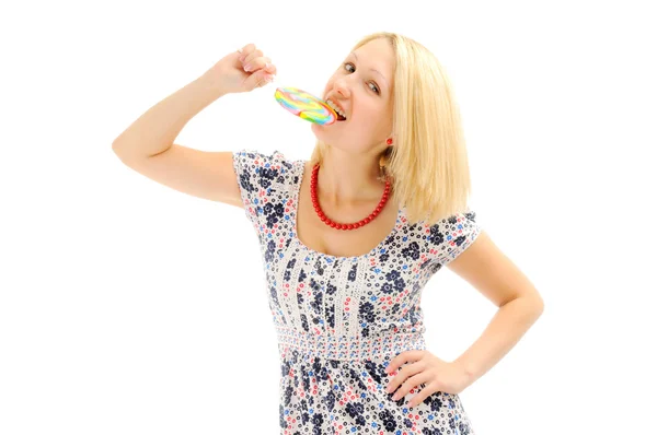 Attractive blonde eating lollipop — Stock Photo, Image
