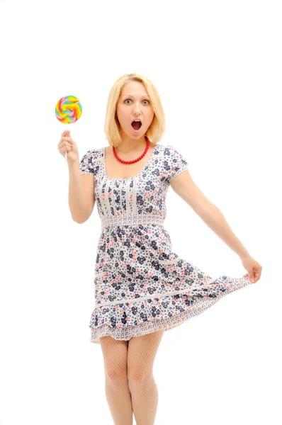 Attraktiva förvånad blondin med lollipop — Stockfoto
