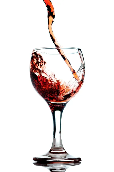 Red wine pouring in glass — Stock Photo, Image
