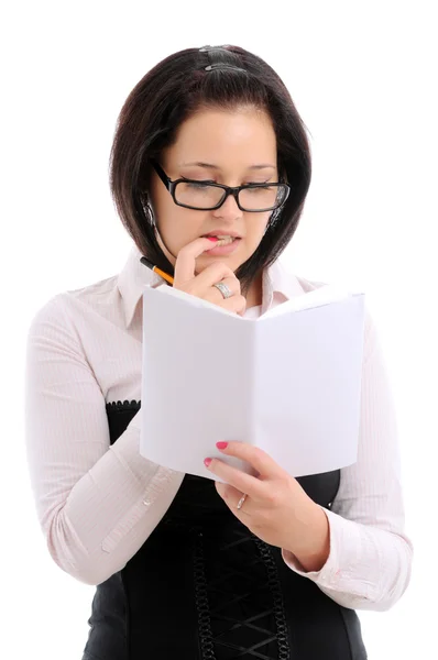 Woman with pencil and book — Stock Photo, Image