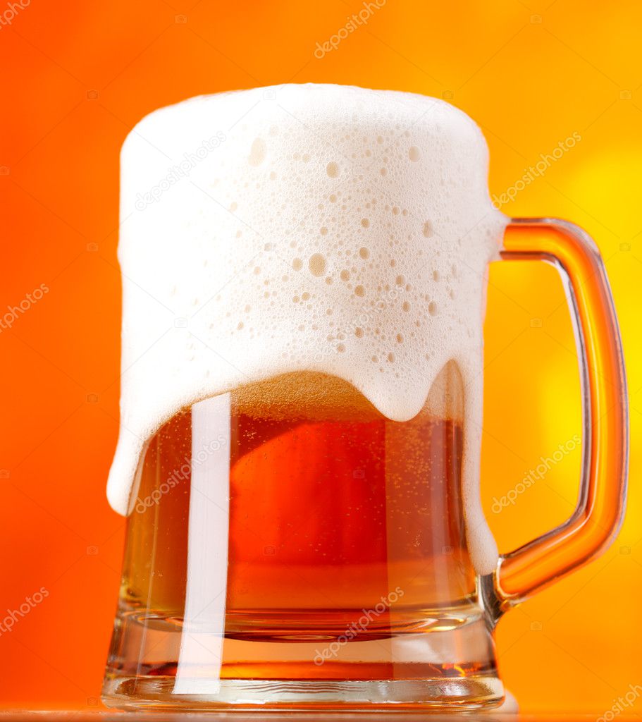 Beer over orange background